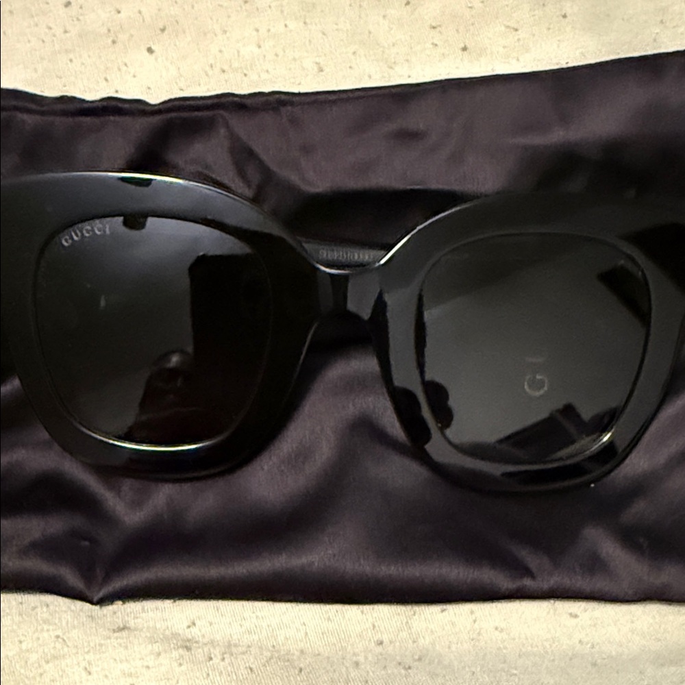 Women fancy Gucci sun glasses.